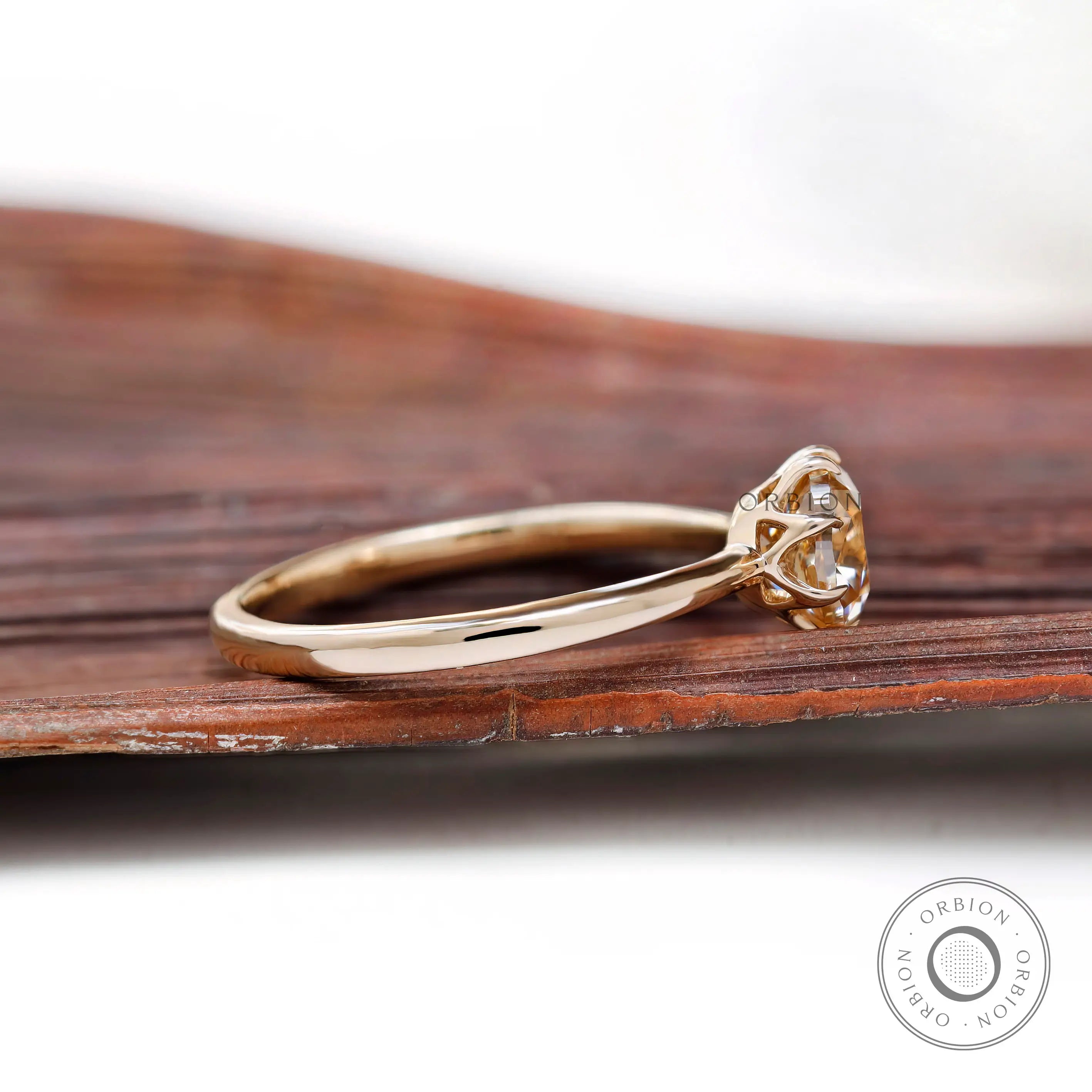 Side view of Champagne Moissanite solitaire ring showing delicate band