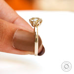 Champagne Moissanite solitaire ring viewed from side with a focus on setting