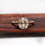 Cushion Old Mine Cut light champagne moissanite solitaire ring in yellow gold front view