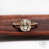 Cushion Old Mine Cut light champagne moissanite solitaire ring in yellow gold front view