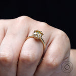 Hand-held side angle of cushion Old Mine Cut moissanite solitaire ring