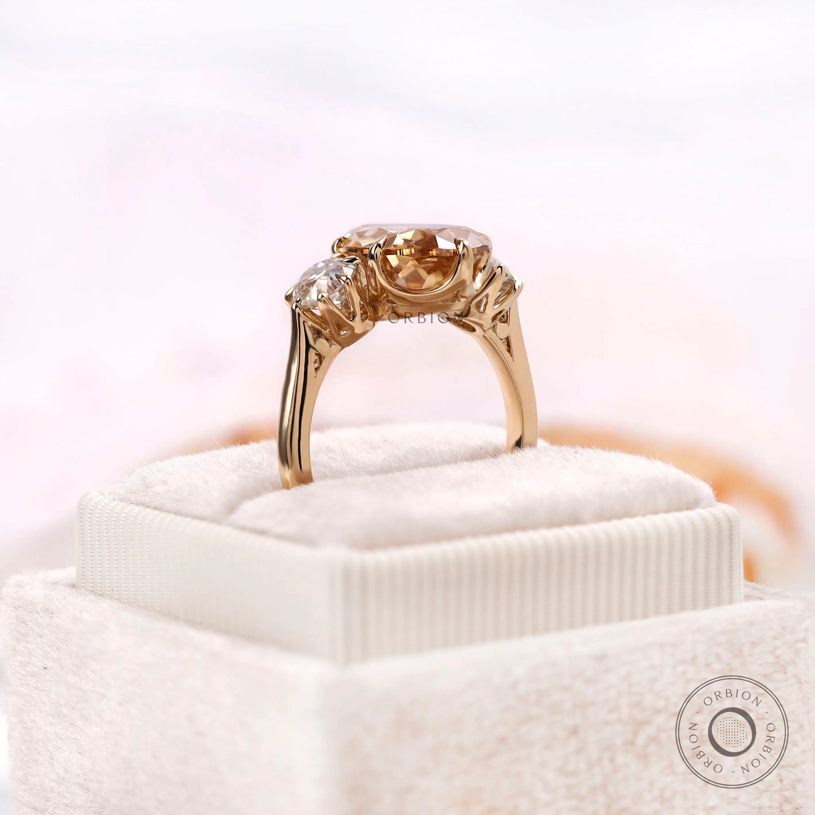 Antique style pear champagne moissanite ring with round accents side view