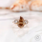 Georgian style three stone pear dark champagne moissanite engagement ring