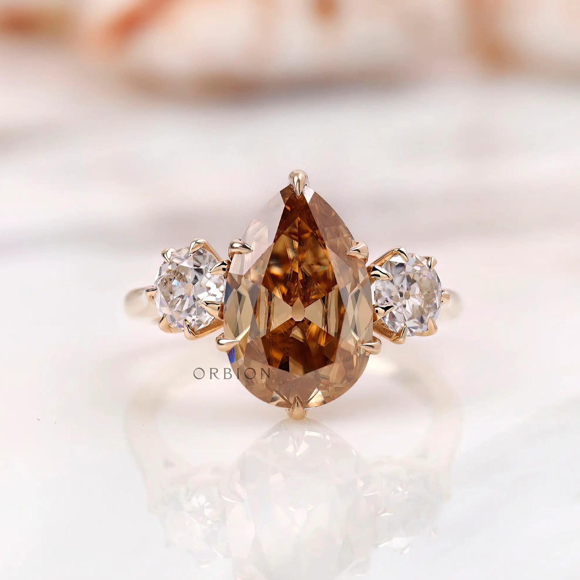 Georgian style three stone pear dark champagne moissanite engagement ring