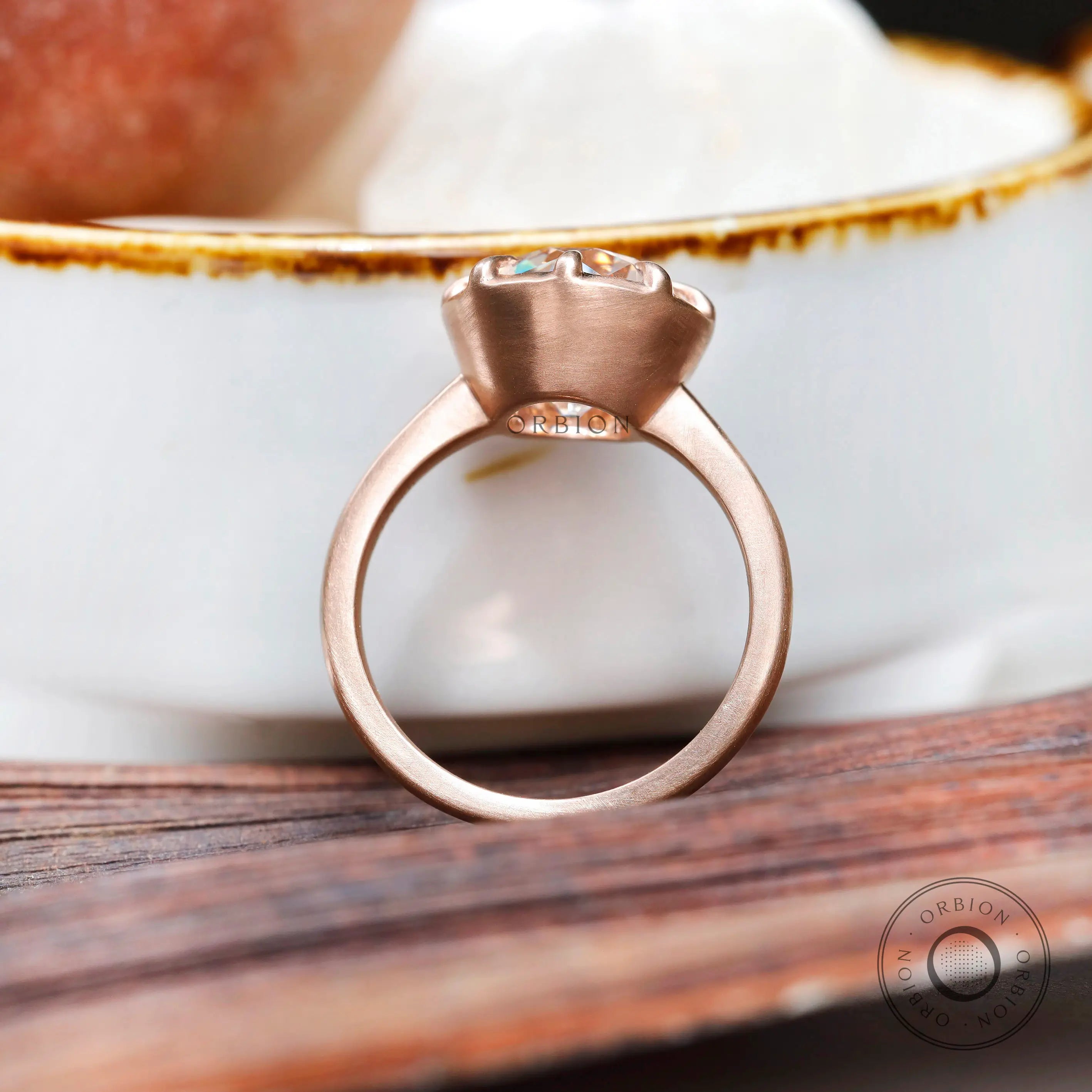 Rear view of rose gold solitaire ring with sculpted head
