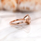 Side profile view highlighting elevated basket setting in rose gold