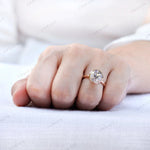 Close-up hand view emphasizing stone size and classic solitaire look