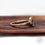 Side view pear moissanite ring with prong setting