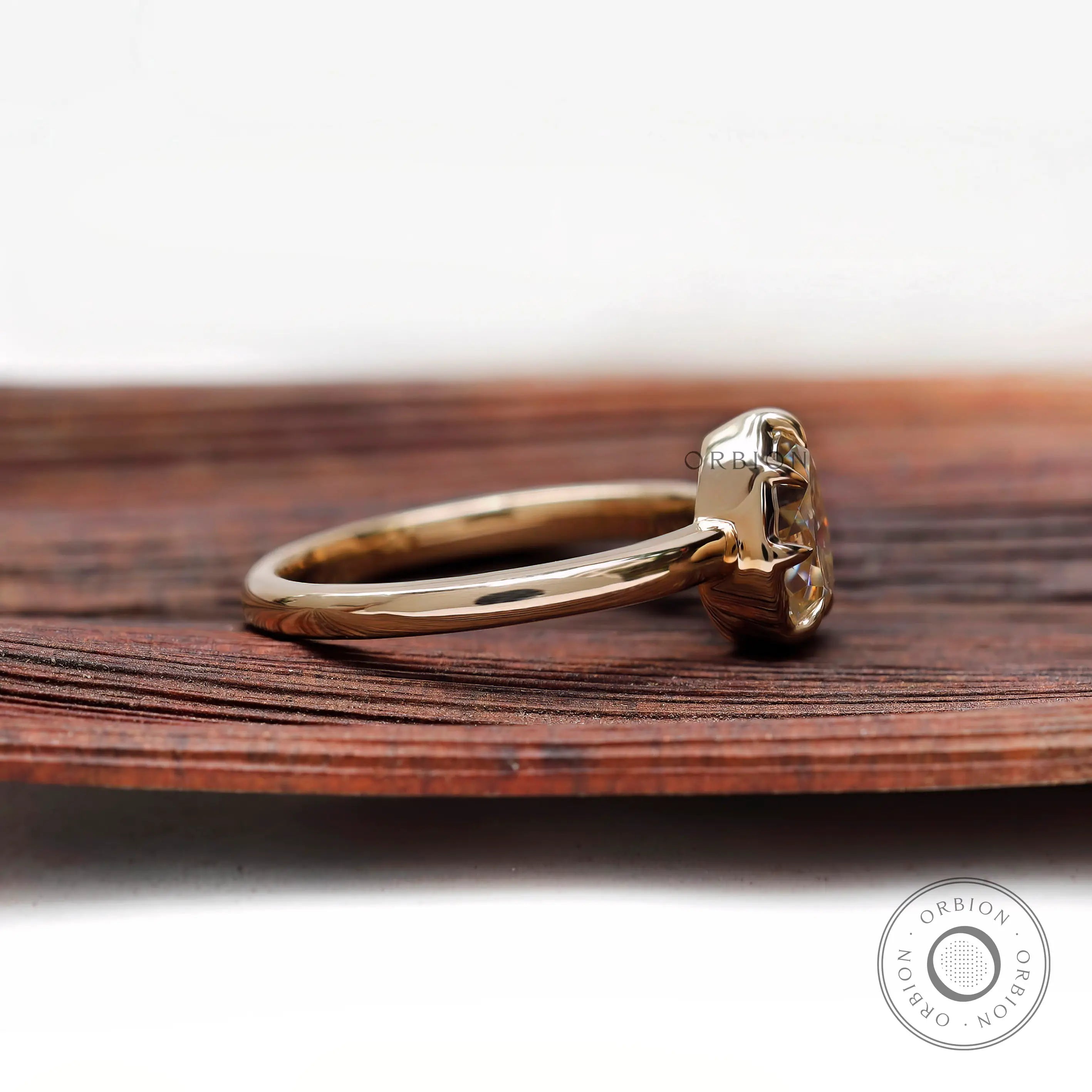 Side view pear moissanite ring with prong setting