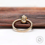 Underside view of pear moissanite solitaire ring