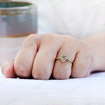 Pear moissanite solitaire ring worn on hand