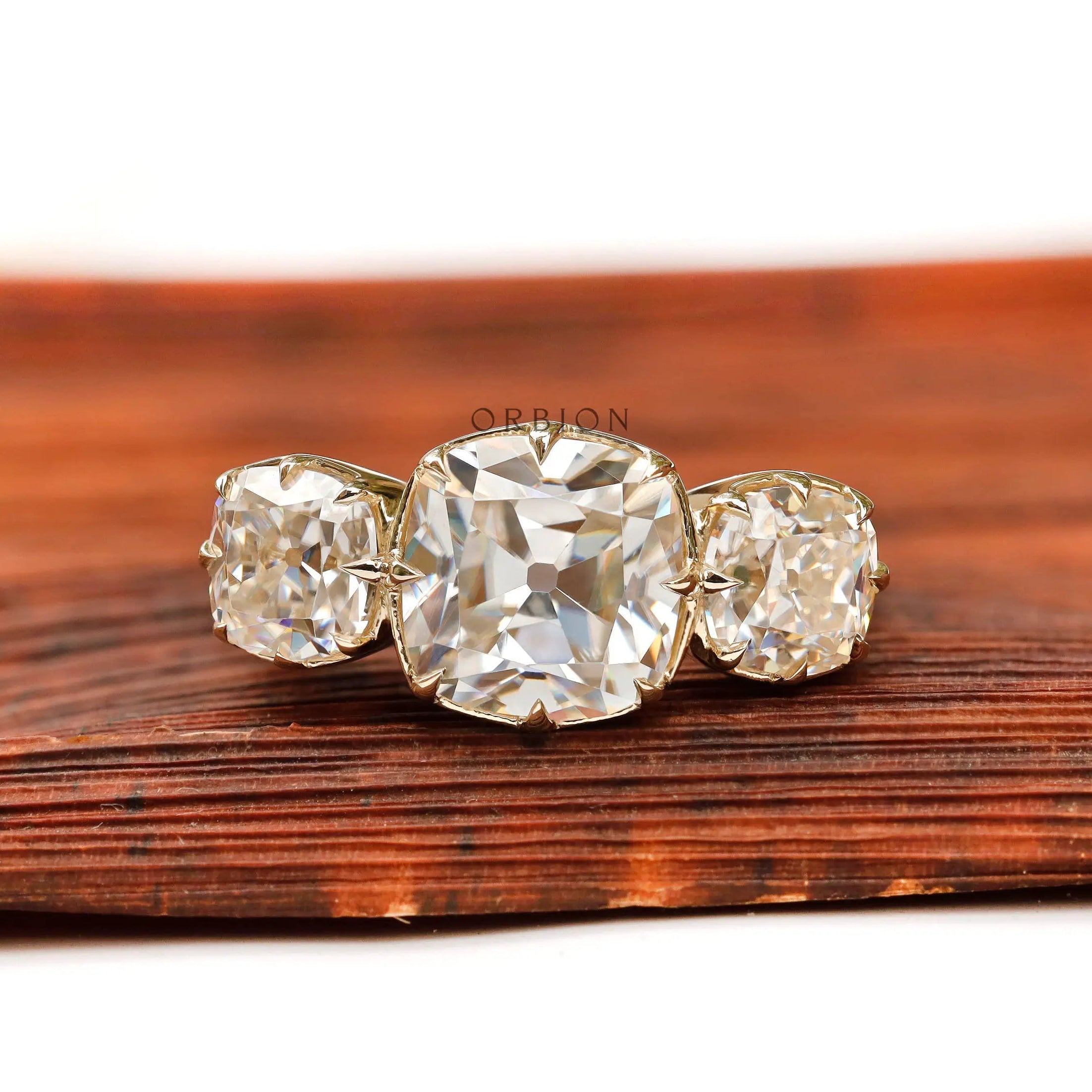Square cushion Old Mine cut three stone moissanite ring top view
