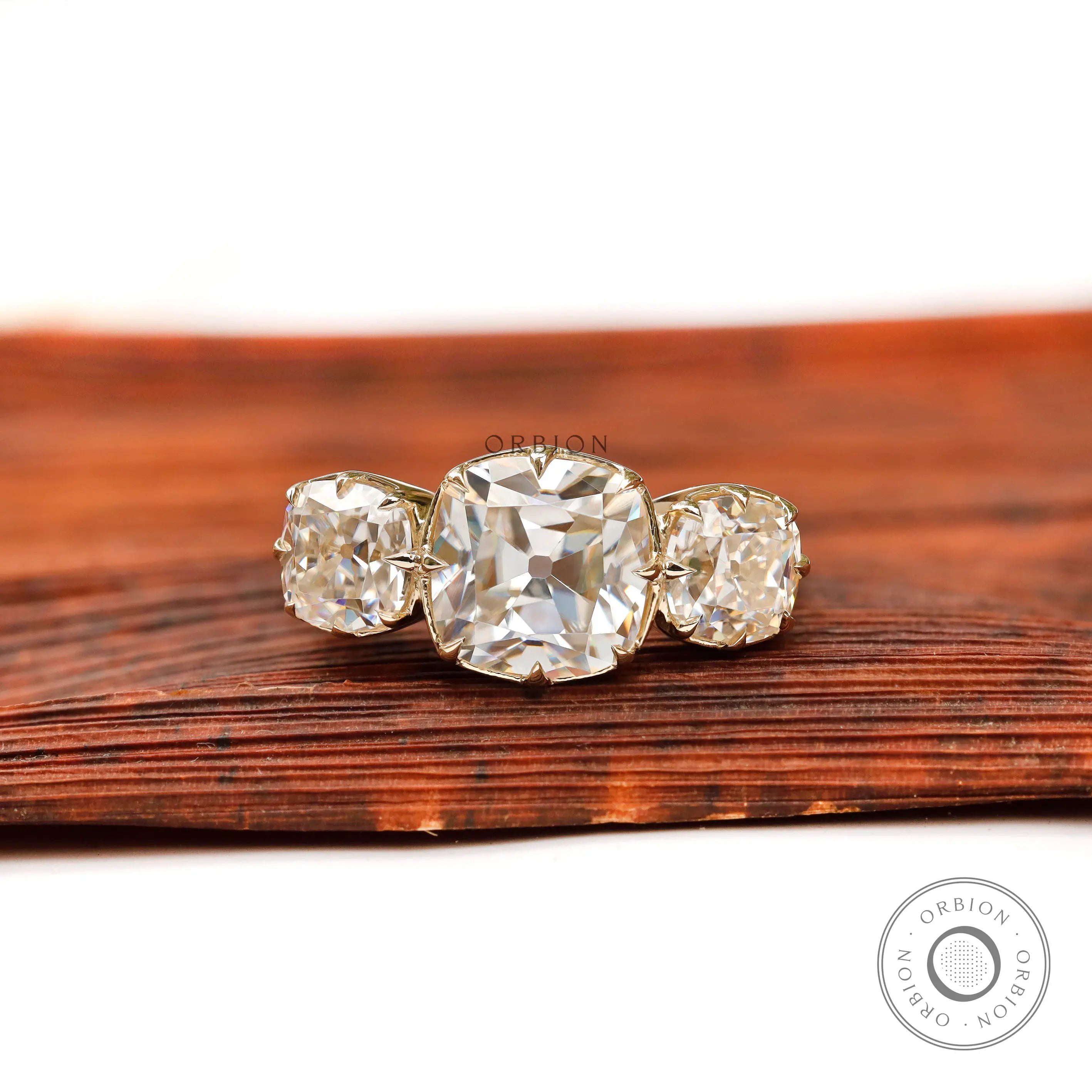 Square cushion Old Mine cut three stone moissanite ring top view