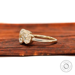 Side profile showing prong setting of cushion moissanite stones