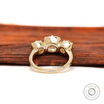 Underside gallery view of three stone moissanite ring