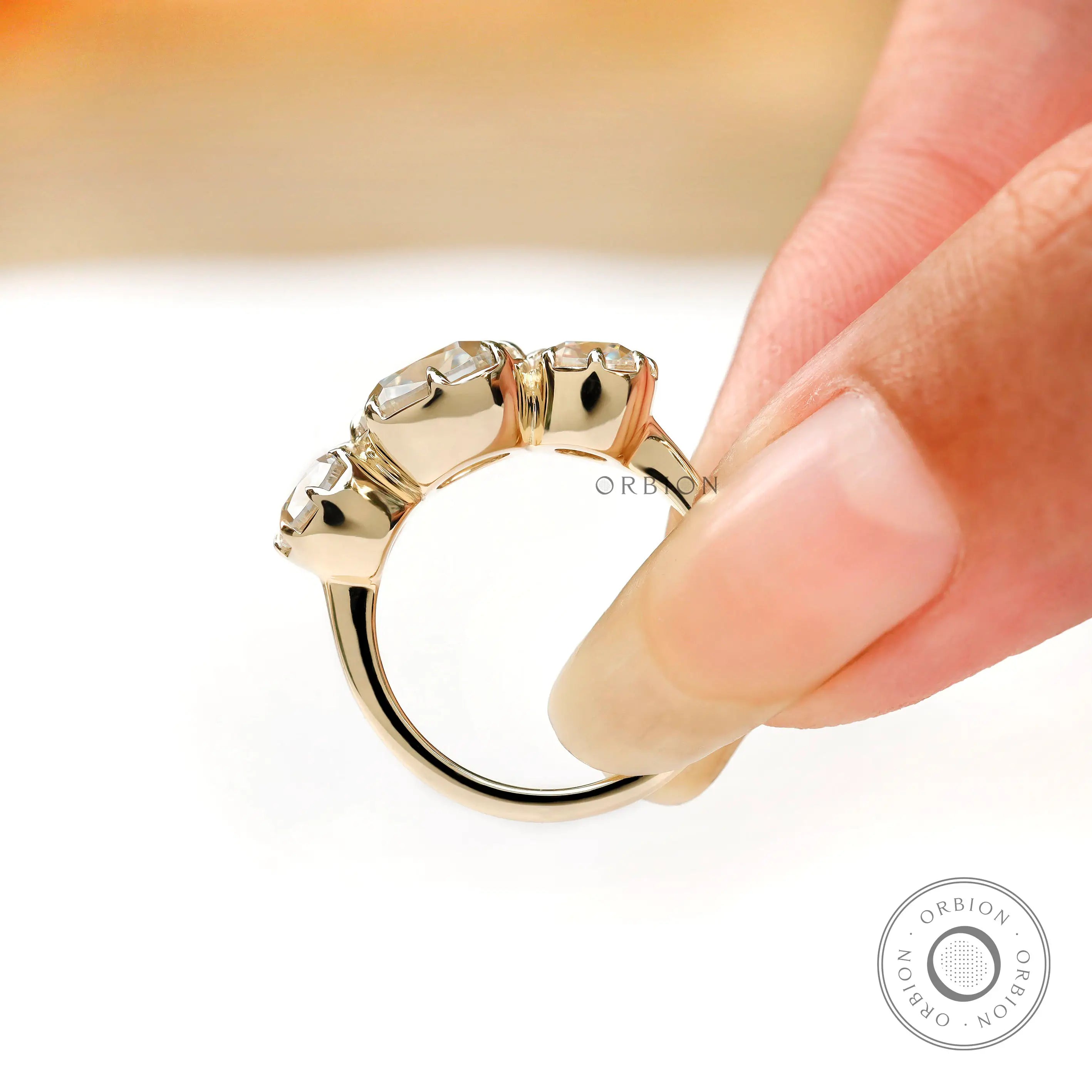 Minimal gold band with three stone arrangement