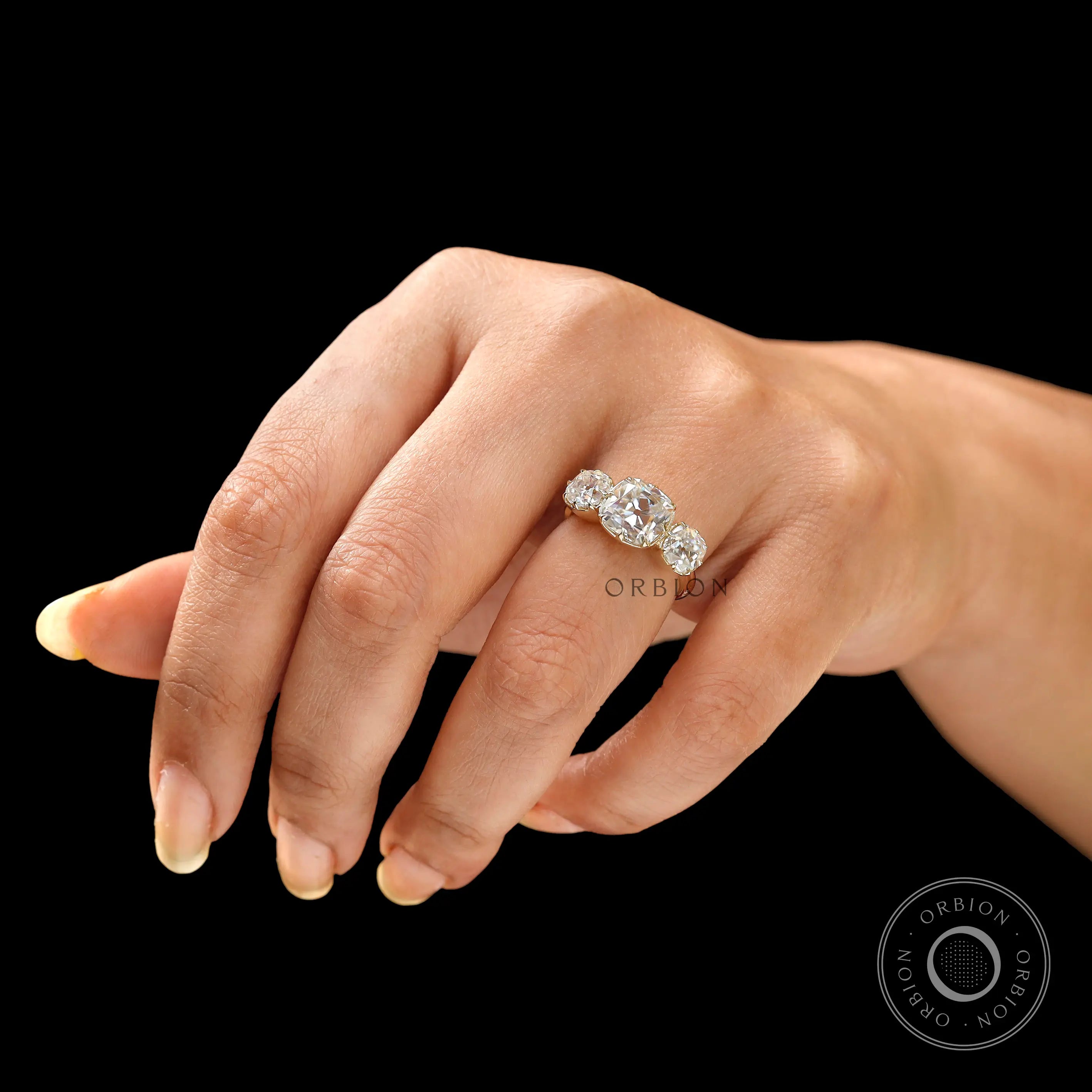 Hand worn cushion moissanite ring front perspective
