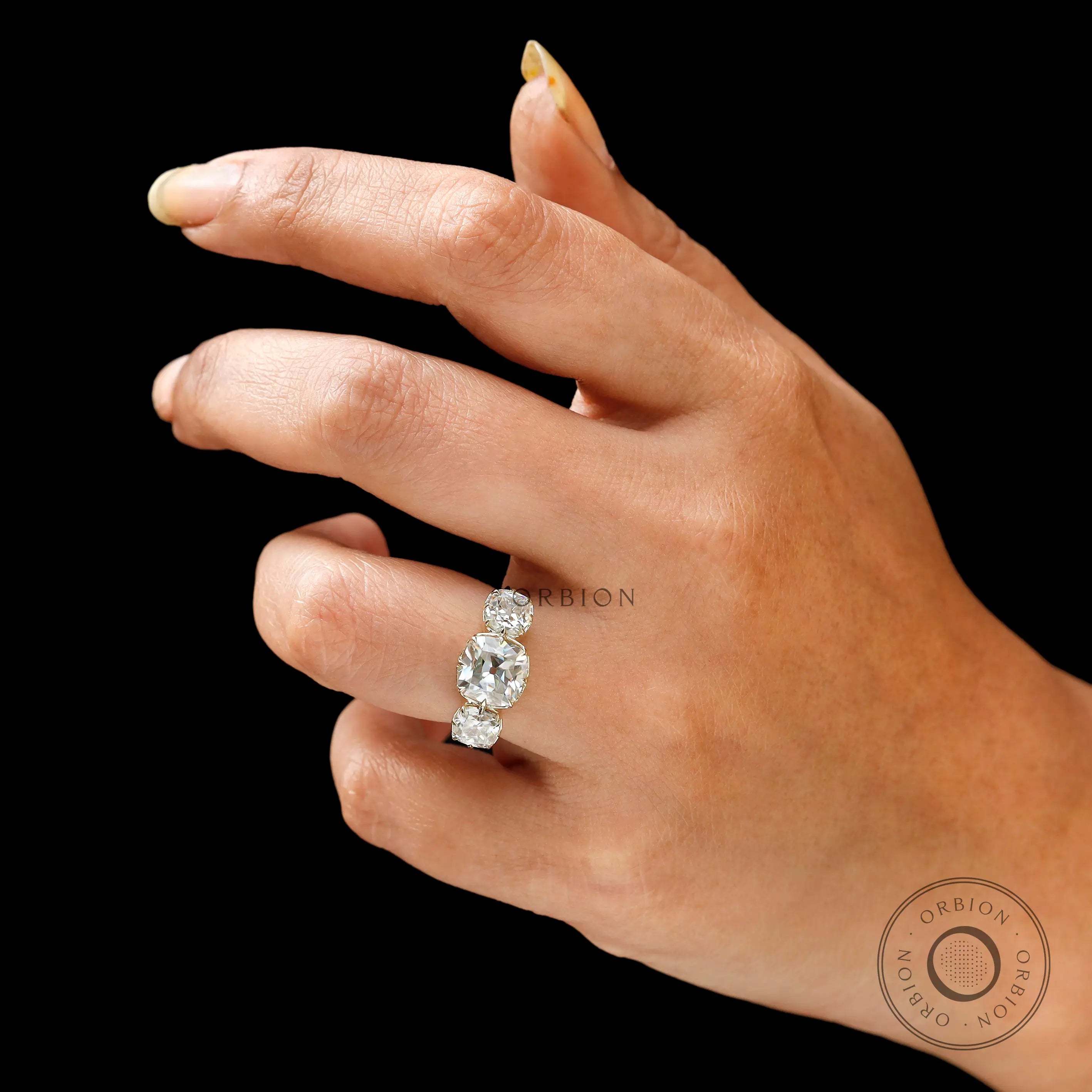 Vintage inspired three stone engagement ring in yellow gold