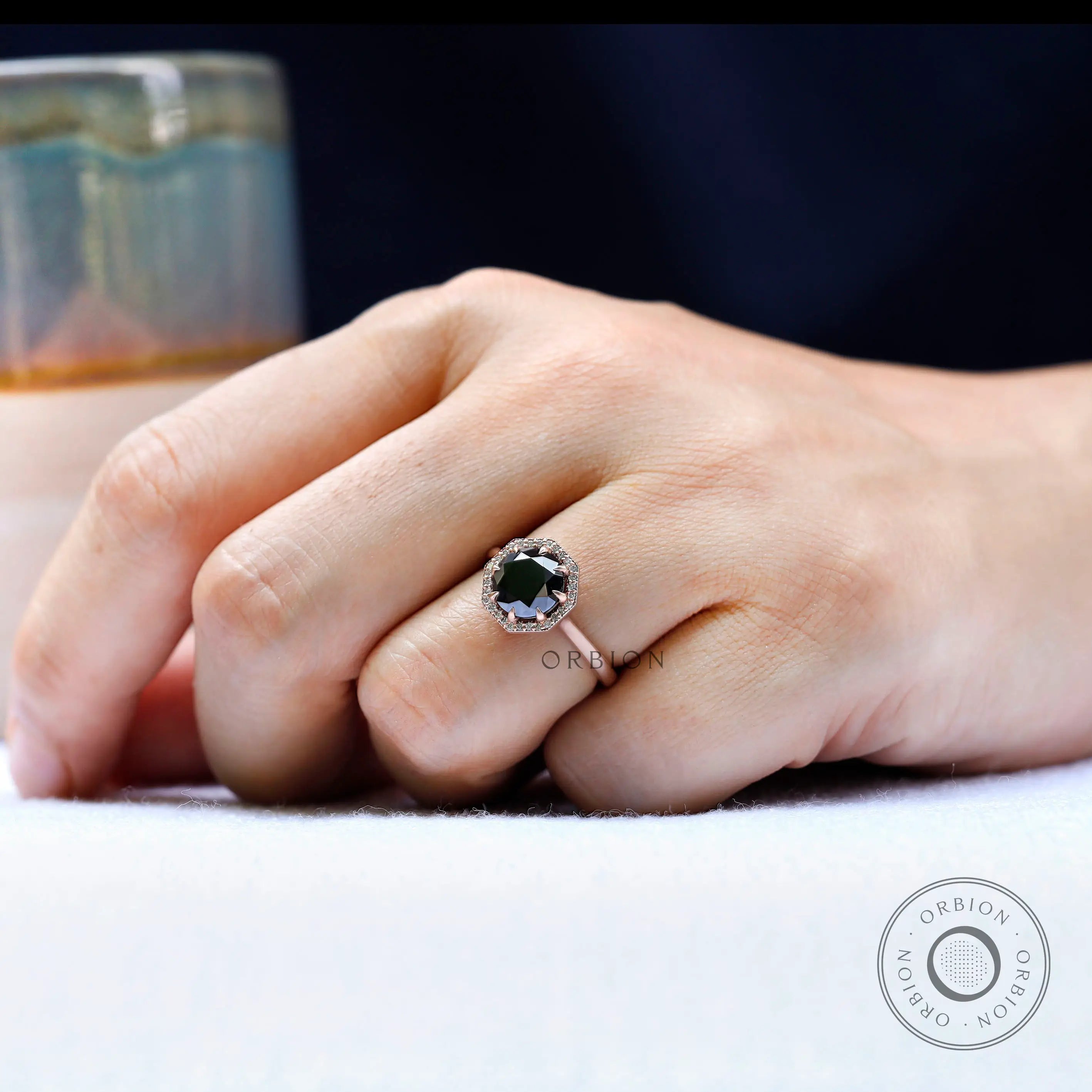 Round Old European Cut black moissanite halo ring in rose gold on hand view