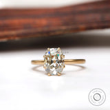 Elongated cushion Old Mine Cut moissanite solitaire ring in yellow gold front view
