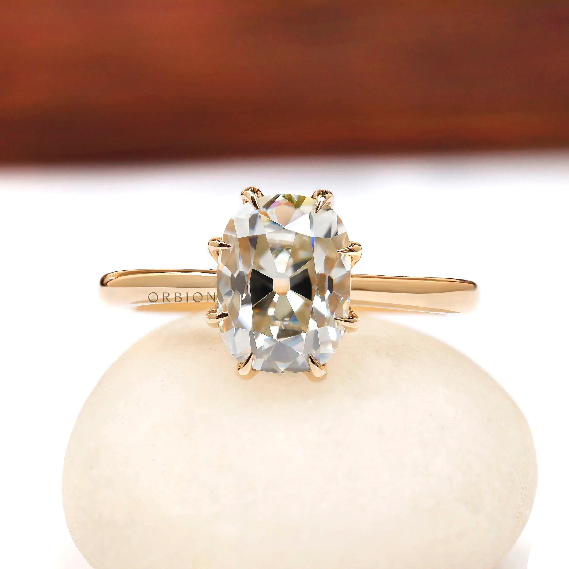 Elongated cushion Old Mine Cut moissanite solitaire ring in 10K yellow gold front view
