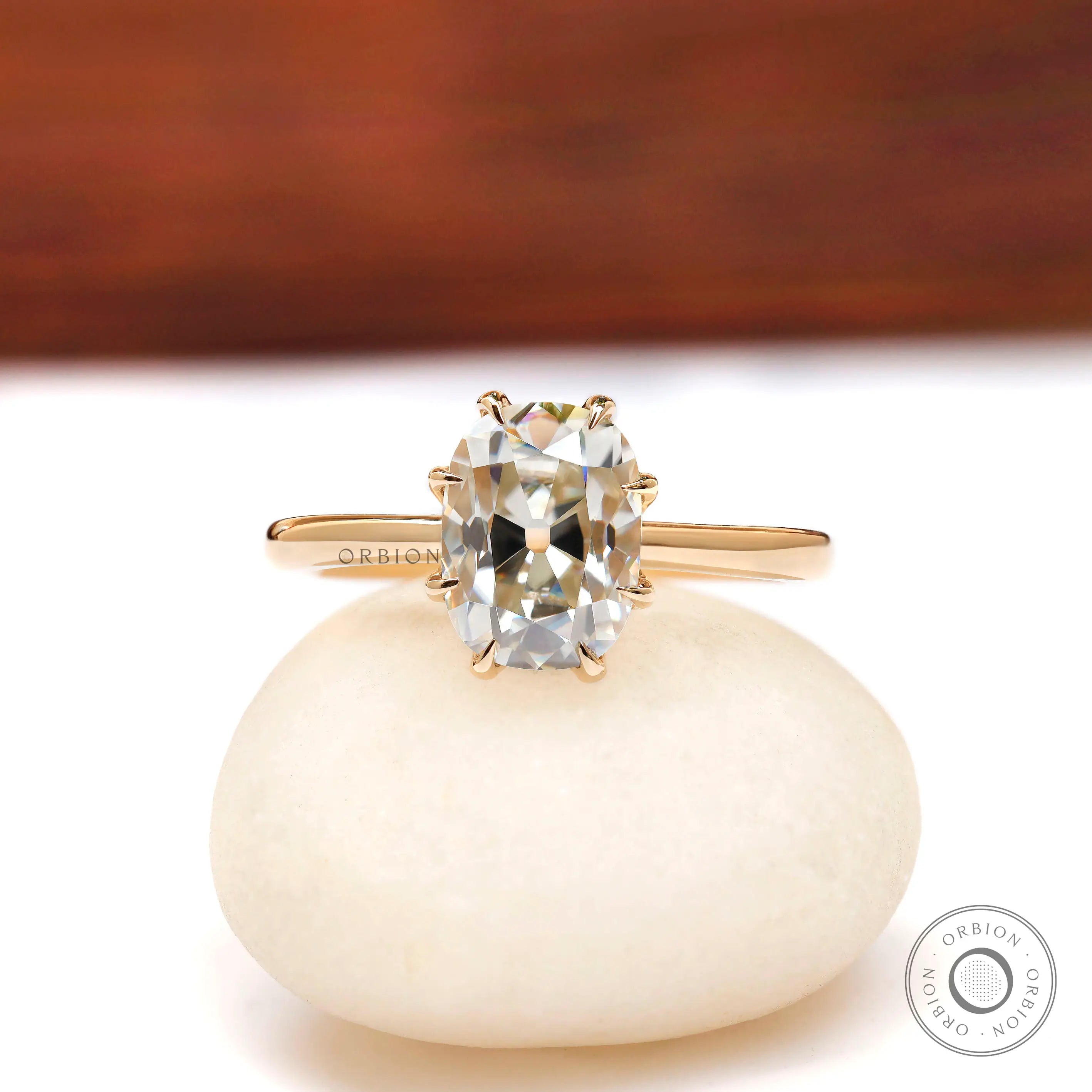 Elongated cushion Old Mine Cut moissanite solitaire ring in 10K yellow gold front view
