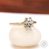 Cushion moissanite solitaire engagement ring high polish yellow gold