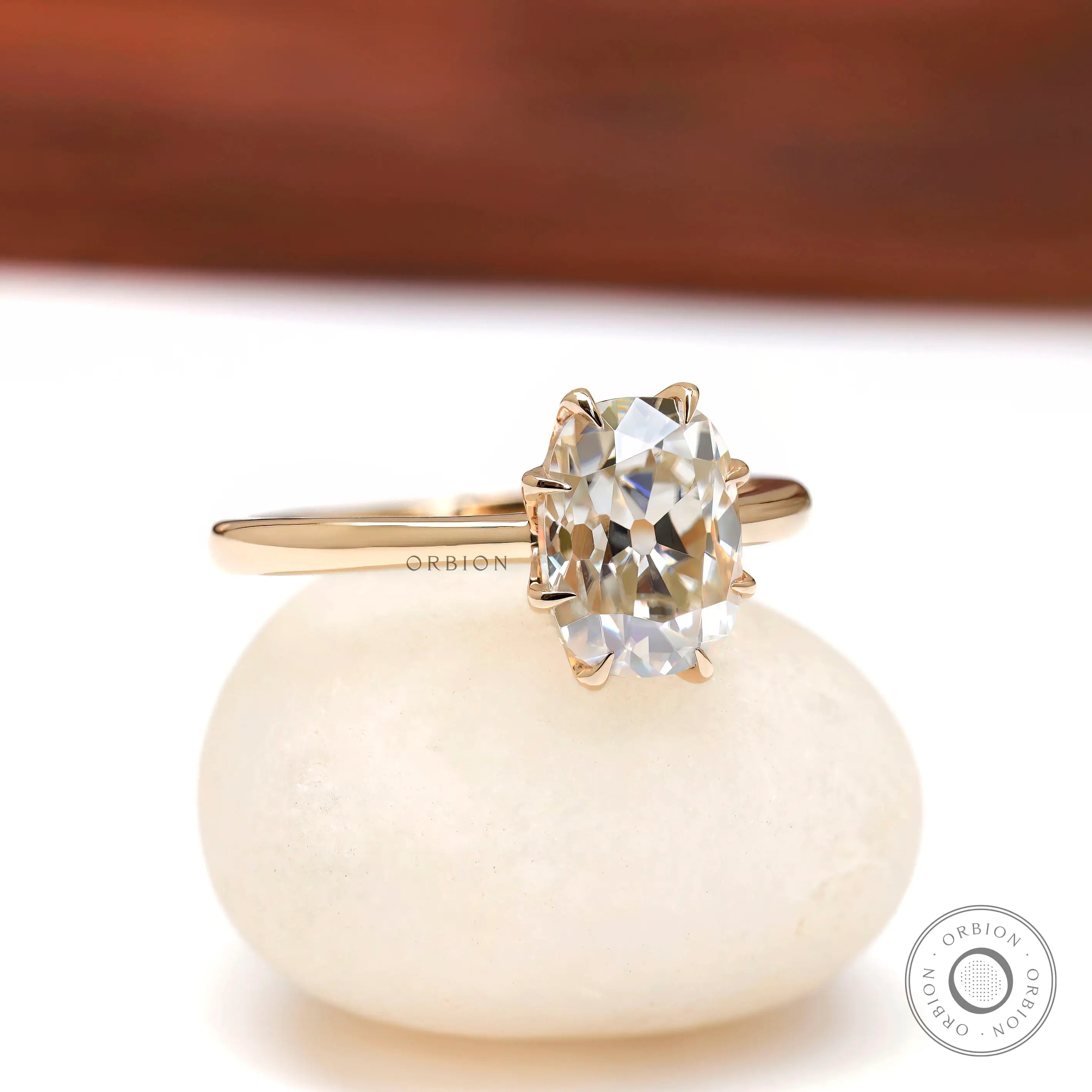Cushion moissanite solitaire engagement ring high polish yellow gold