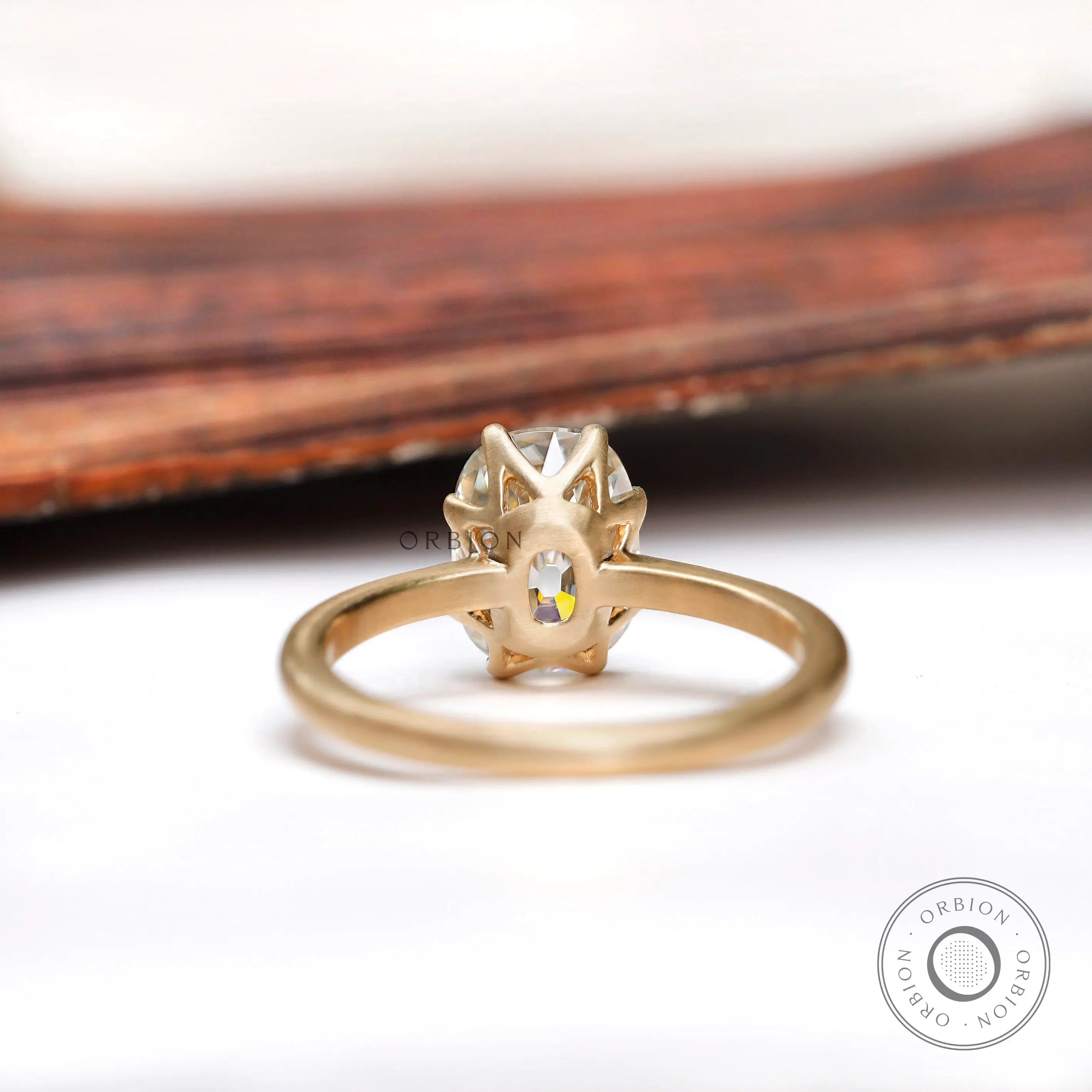 Under-gallery view of Old Mine Cut moissanite solitaire ring