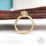 Angled view highlighting prong setting and elongated cushion moissanite