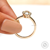 Elongated cushion moissanite solitaire ring on white background