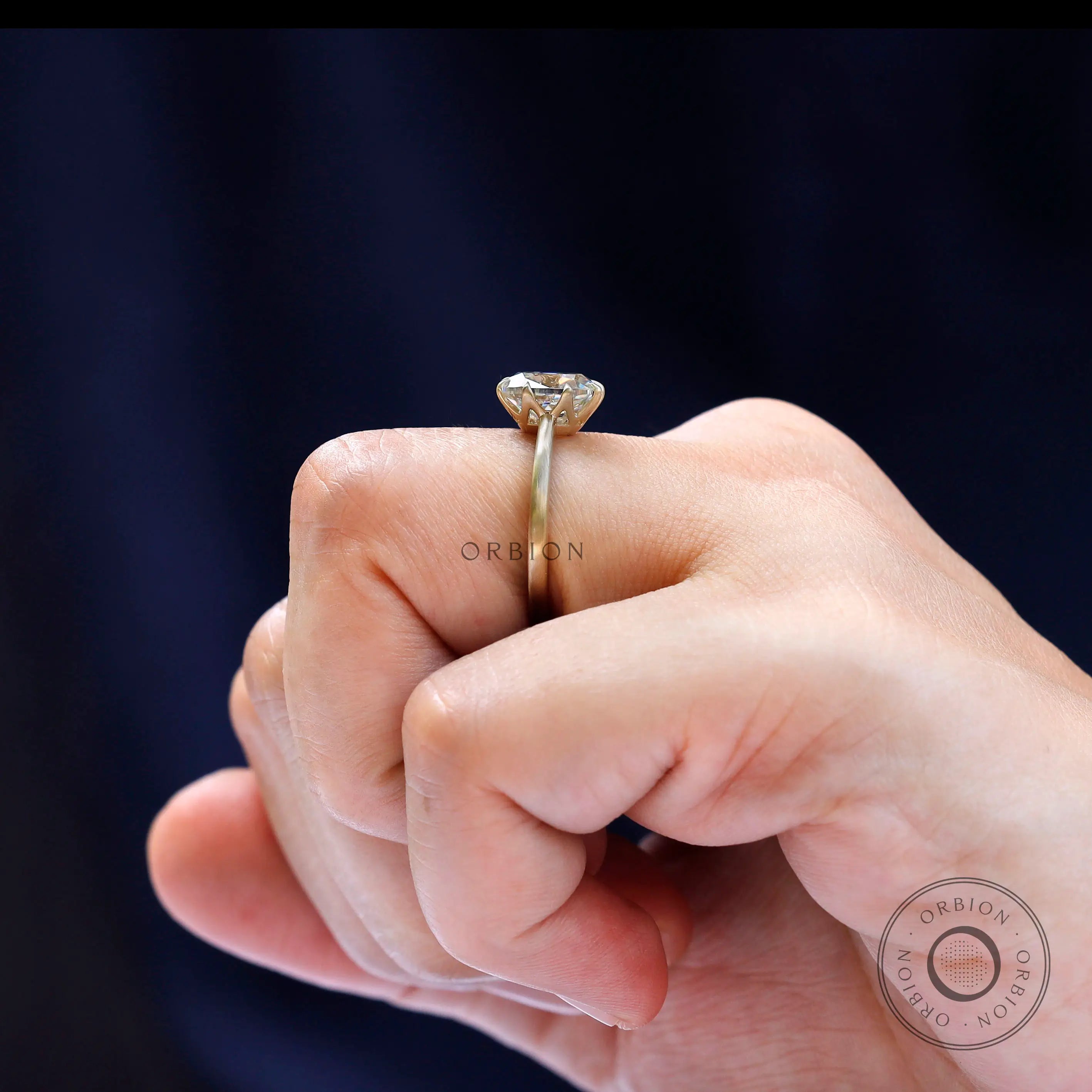 On-hand view of elongated cushion Old Mine Cut moissanite ring