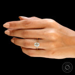 Cushion moissanite engagement ring worn on hand