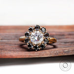 Vintage halo moissanite ring with black accent stones top view