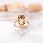 Back view of champagne moissanite bezel ring with elongated cushion stone.