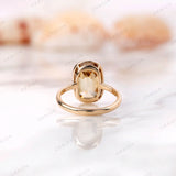 Back view of champagne moissanite bezel ring with elongated cushion stone.
