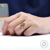 Champagne moissanite bezel ring worn on hand