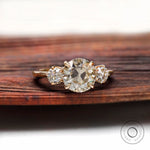 Three stone Old European cut moissanite ring top view in yellow gold