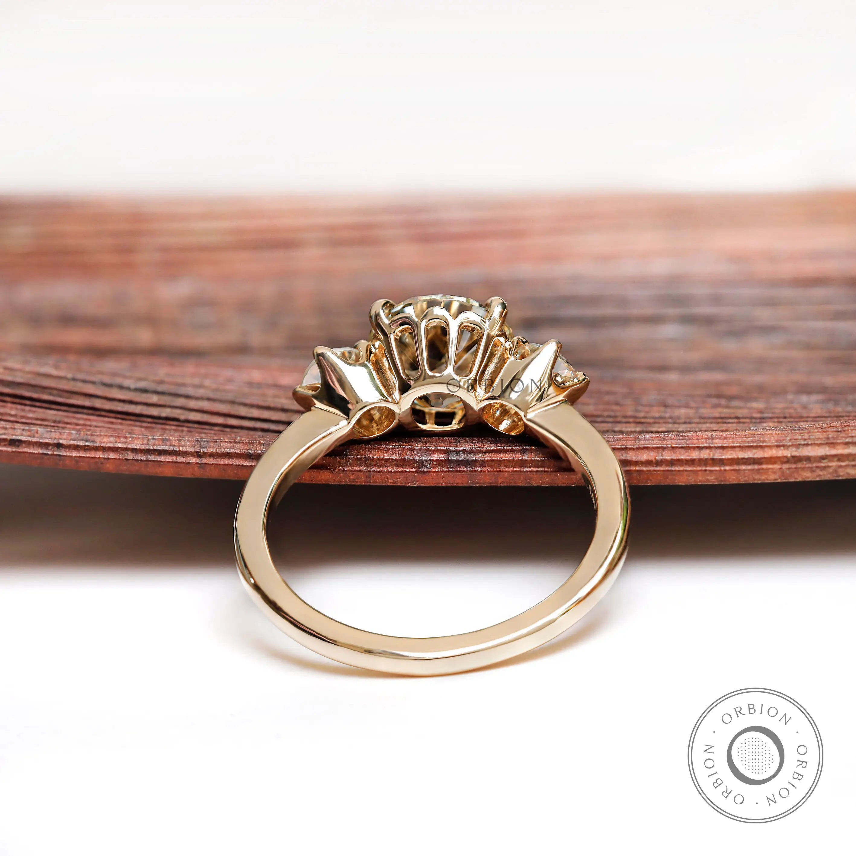 Underside gallery view of three stone moissanite ring