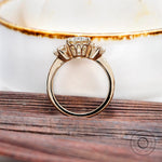 Close-up of center Old European cut moissanite with side stones