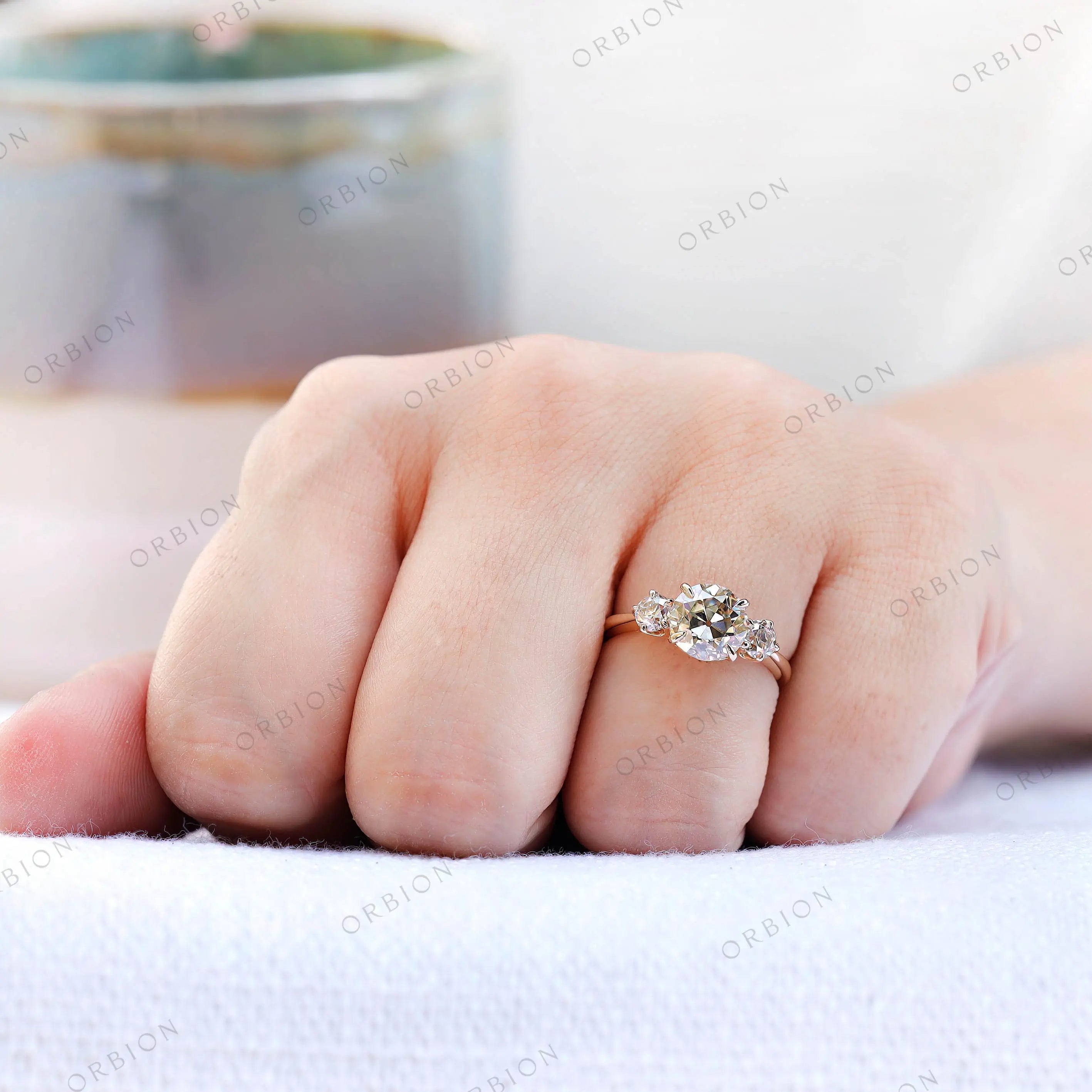 Hand worn trilogy moissanite ring front view