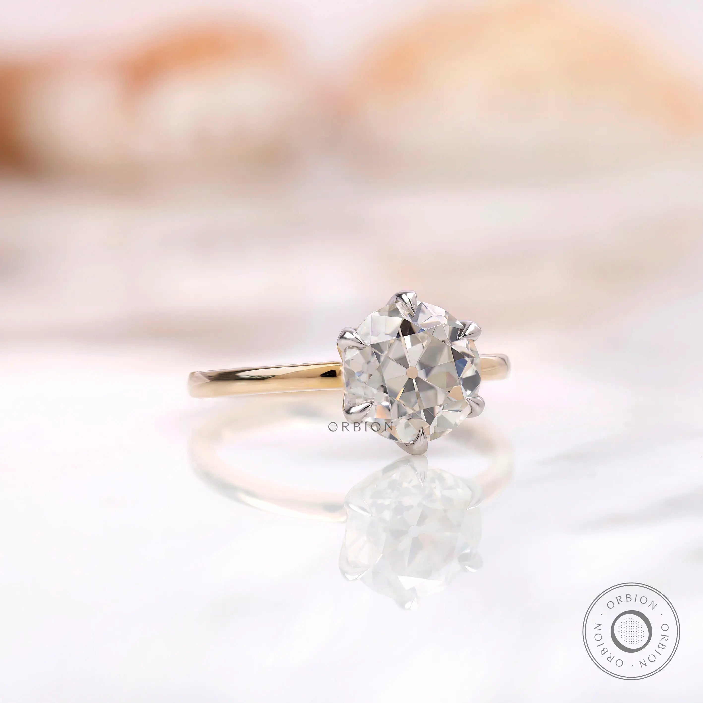 Side view of six prong solitaire OEC Moissanite ring.