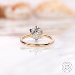 Back view showing OEC Moissanite stone in dual-tone gold setting.