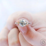 Close-up angled view of OEC Moissanite set in six-prong setting.