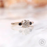 Three stone moissanite engagement ring in 10K yellow gold