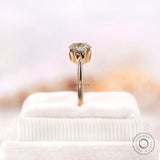 Black and white round moissanite ring glossy yellow gold band