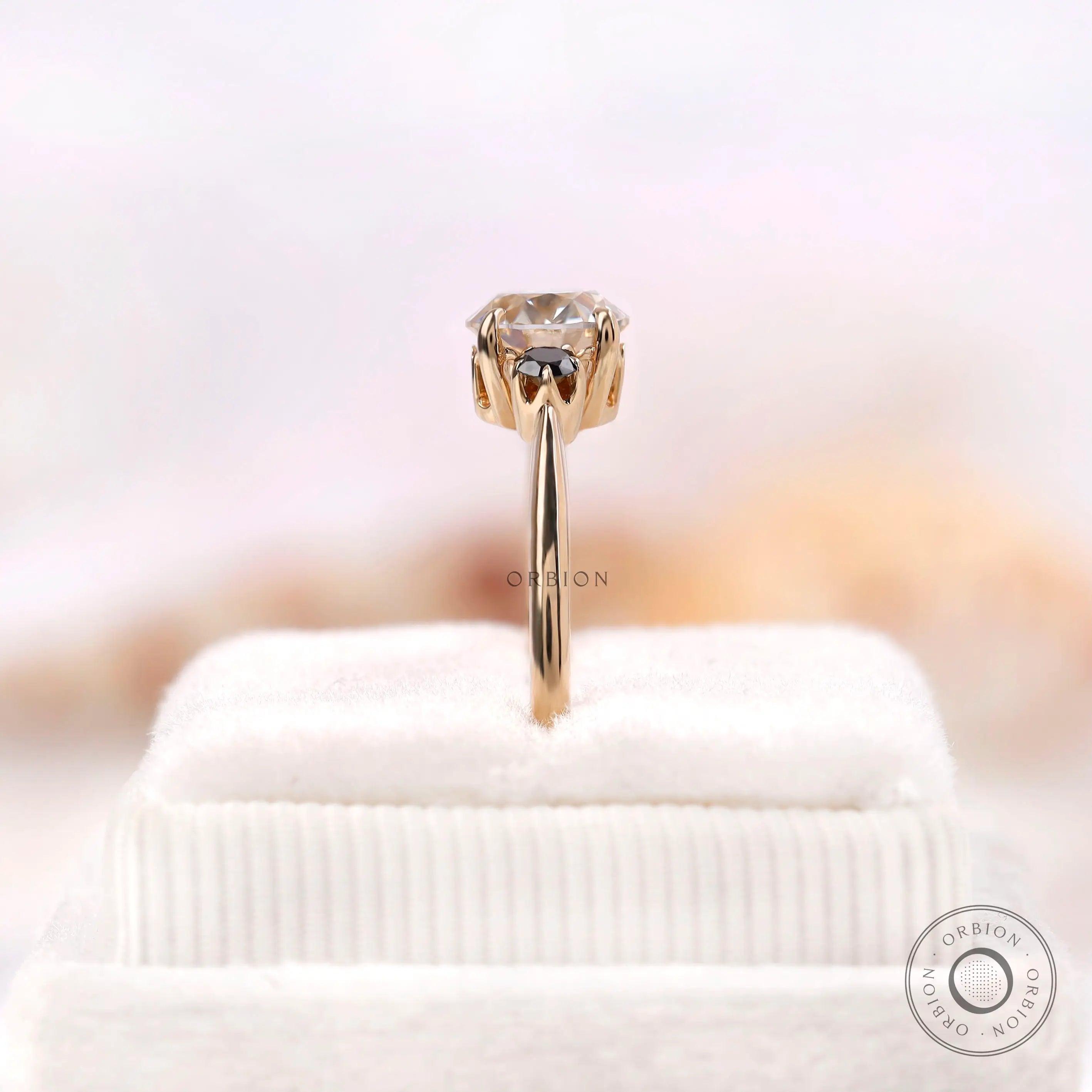 Black and white round moissanite ring glossy yellow gold band