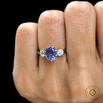 Georgian style oval blue sapphire three stone engagement ring in platinum