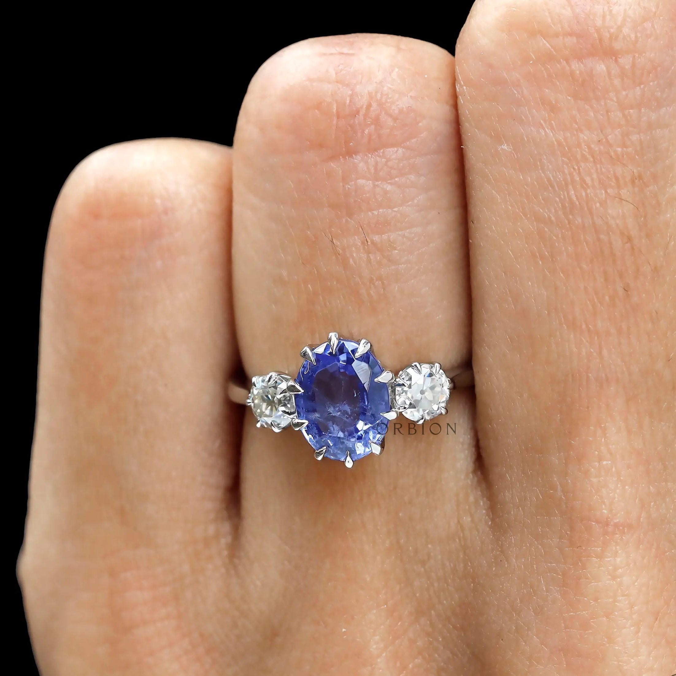 Georgian style oval blue sapphire three stone engagement ring in platinum