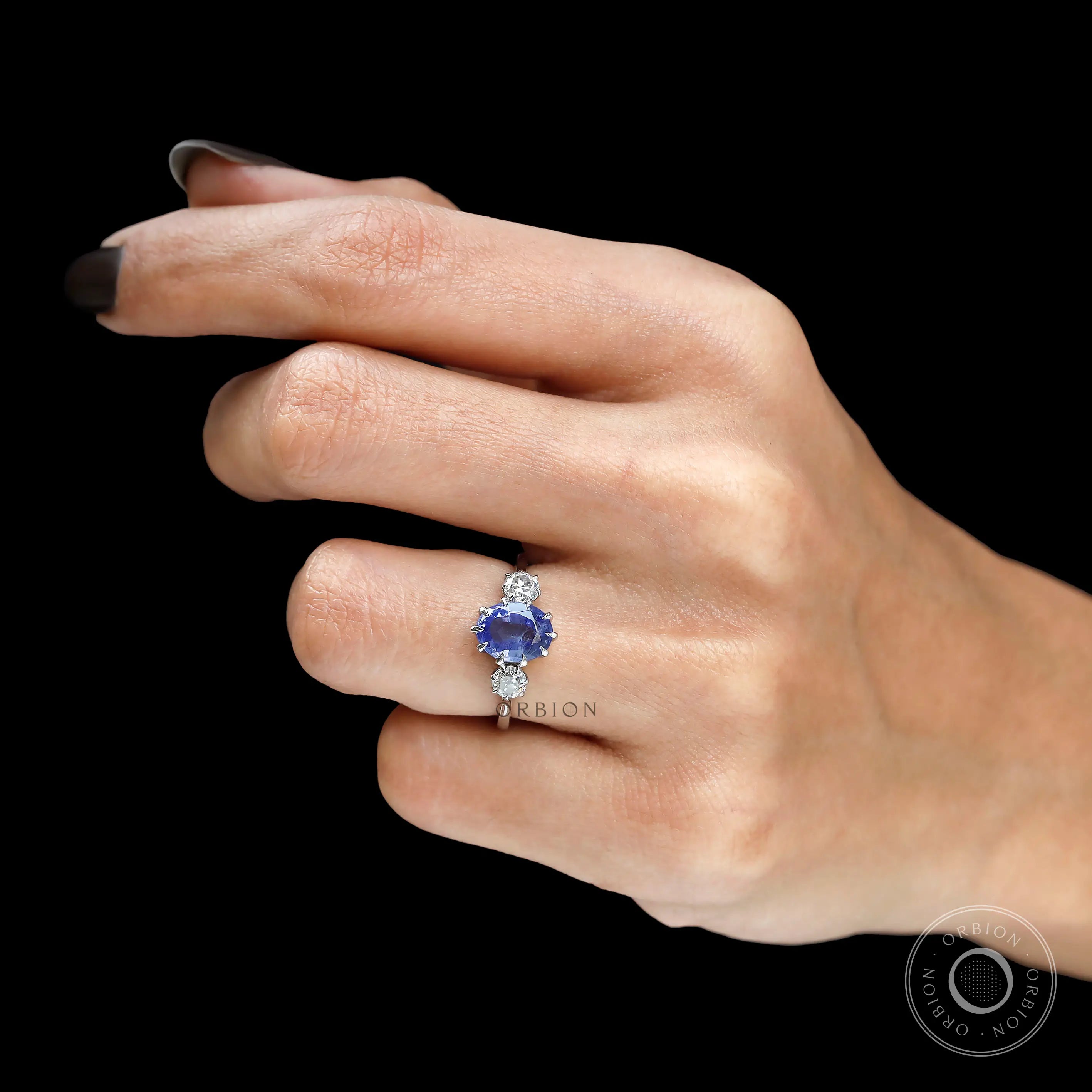 Old European cut diamond side stones on sapphire engagement ring